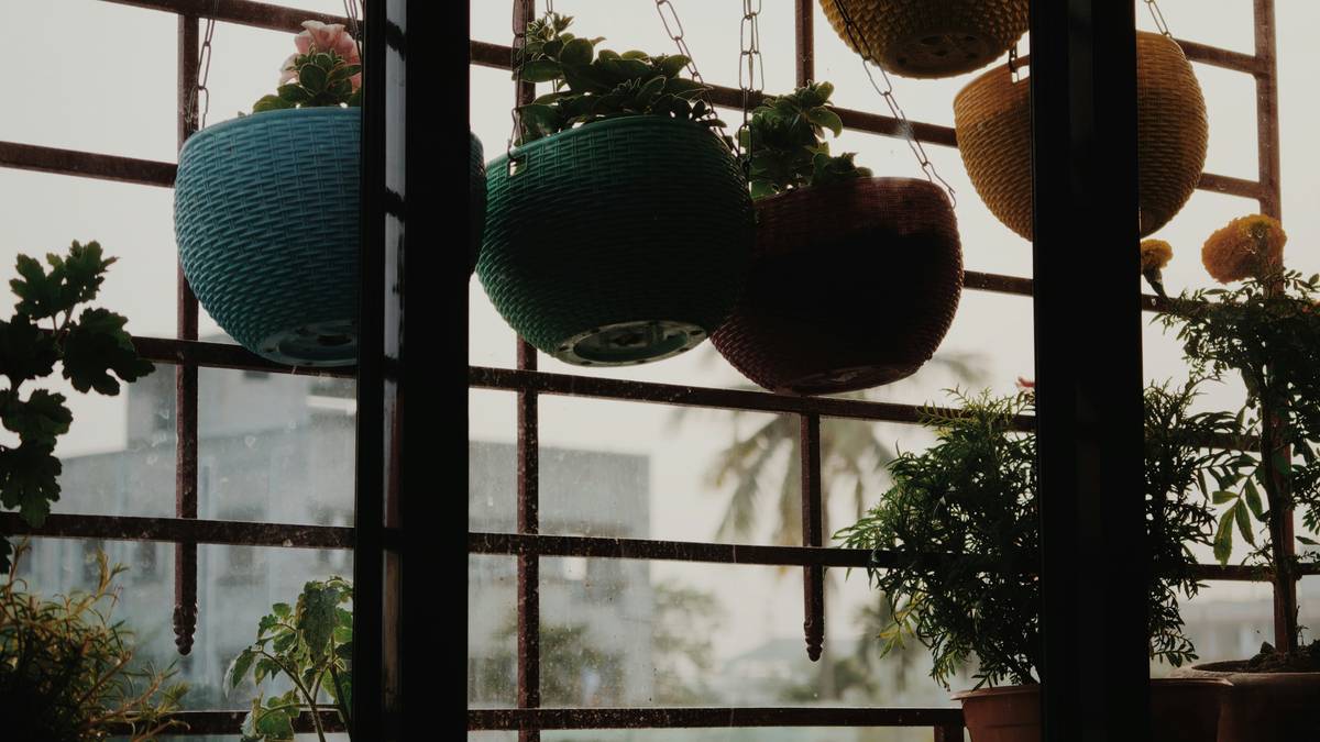 DIY installation of planters for walls outdoors with proper mounting hardware on brick exterior